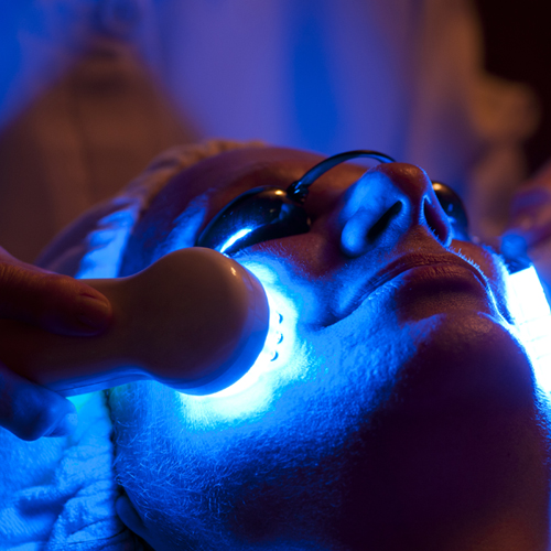 woman in spa receiving LED facial