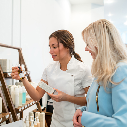 Spa manager and staff member having a discussion