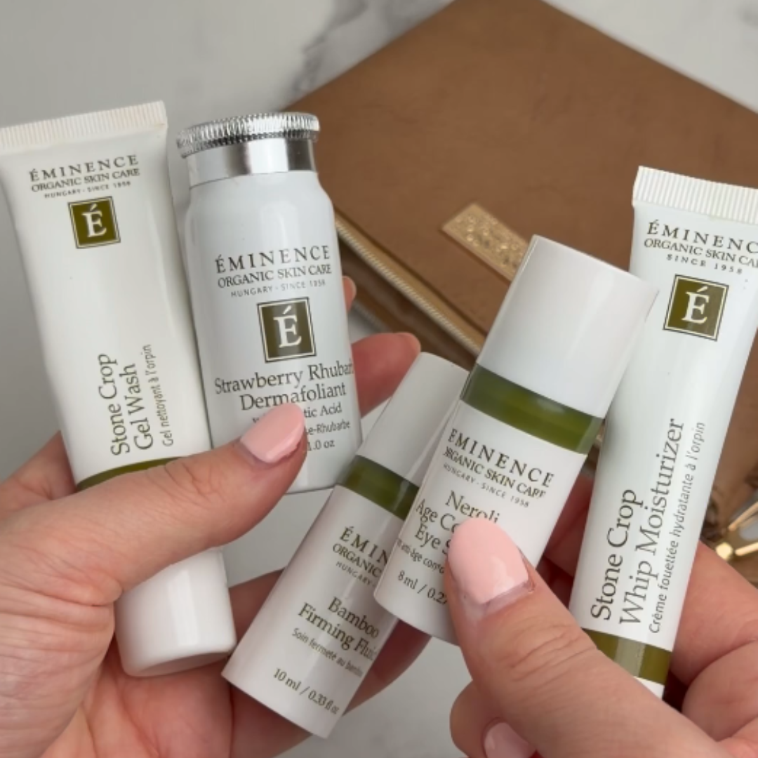 Woman holding the Eminence Organics Strawberry Rhubarb Hyaluronic Hydrator