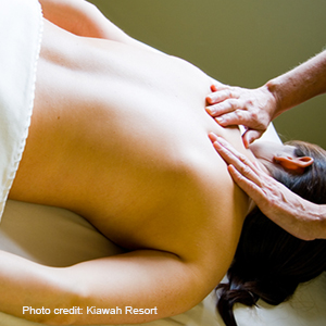 A woman receiving a back massage at Kiawah Resort