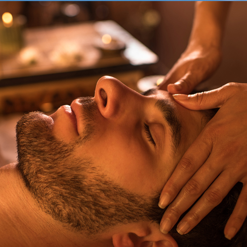 A man getting a facial massage