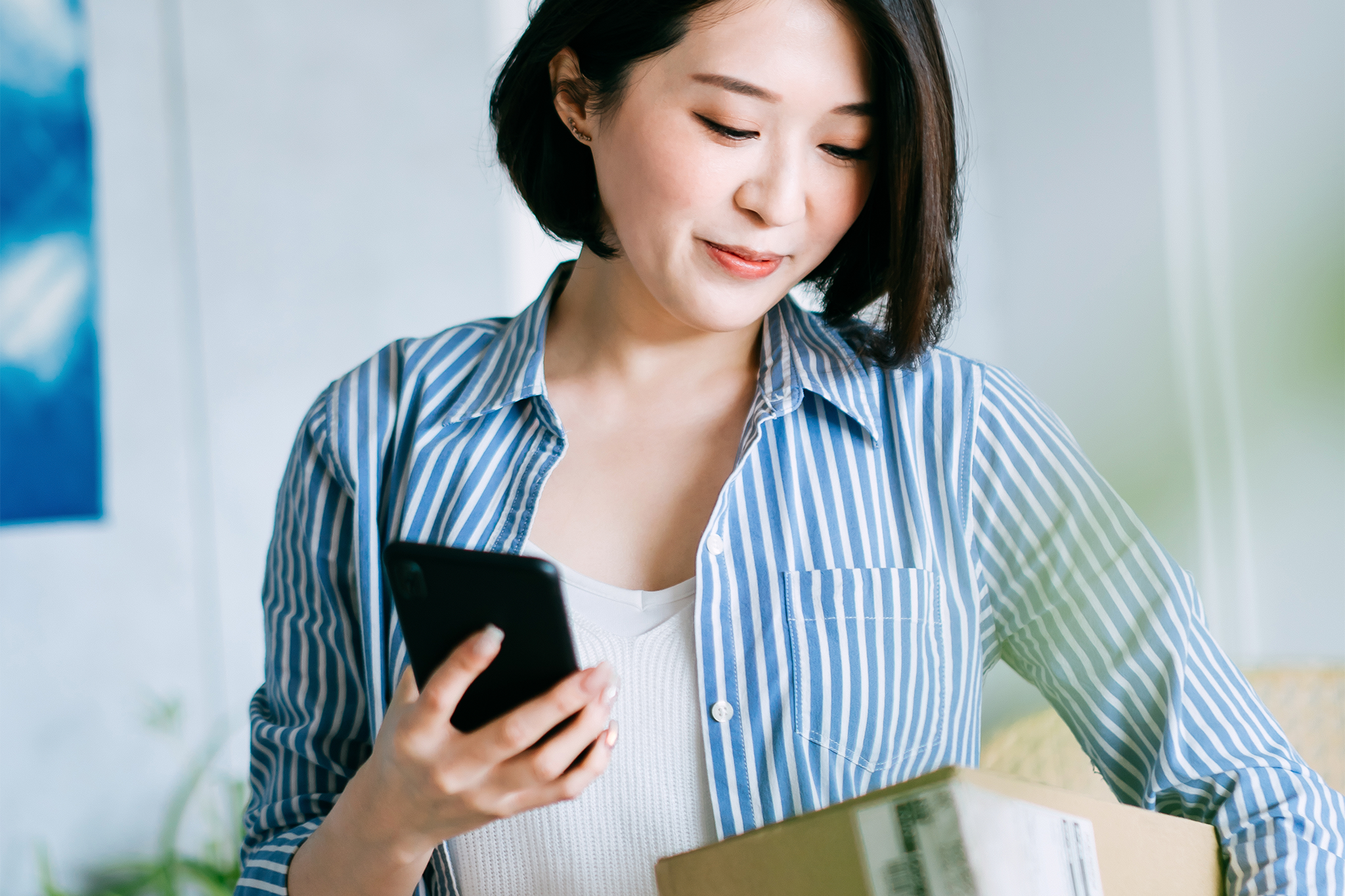 A woman making an online purchase return on her mobile