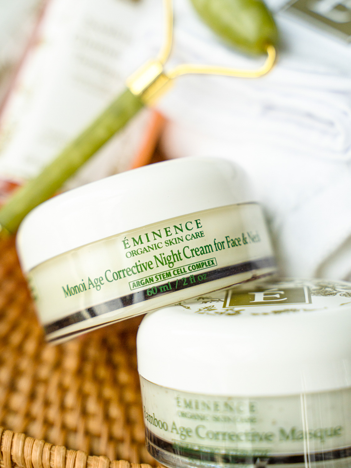 A close up of the Eminence Organics Monoi Age Corrective Night Cream for Face & Neck Jar