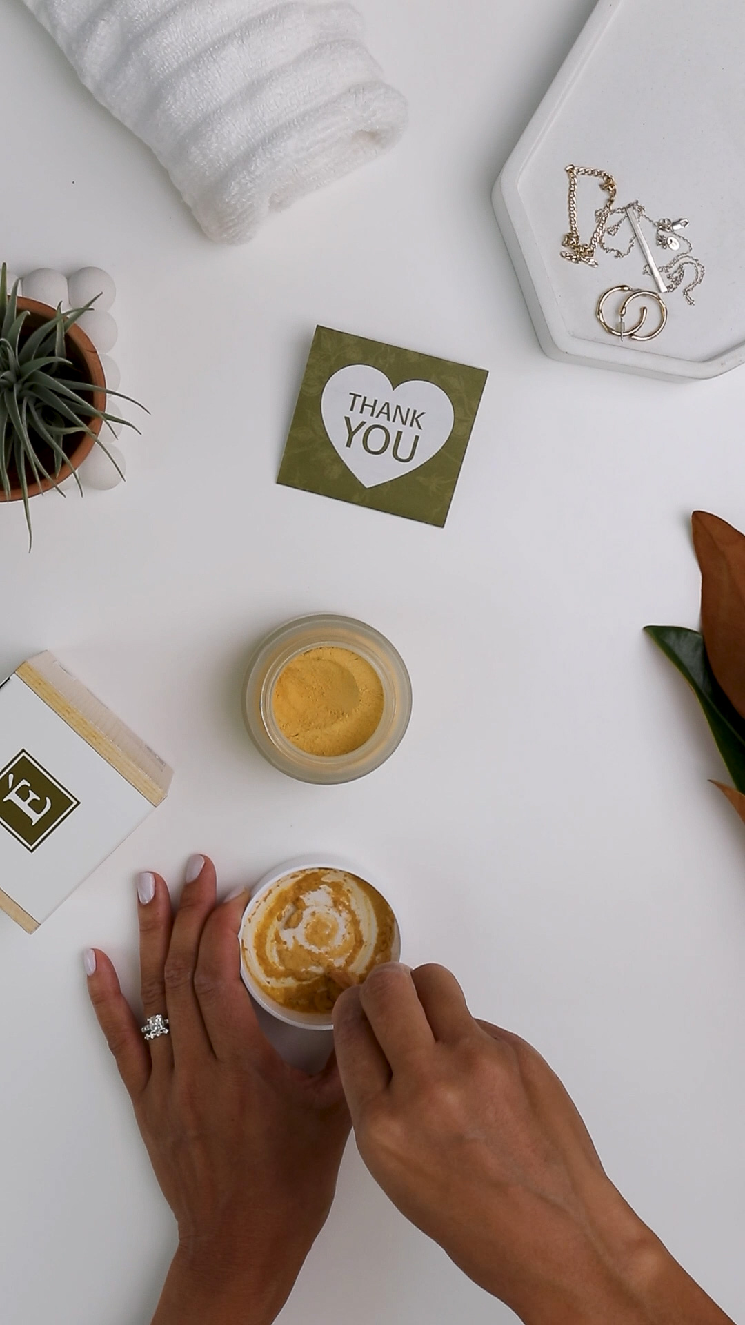 An open jar of the Eminence Organics Turmeric Energizing Treatment