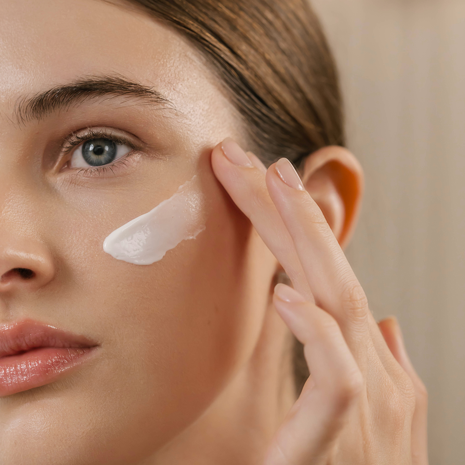 Woman with a swatch of Eminence Organics Ceramide Repair Balm on her face