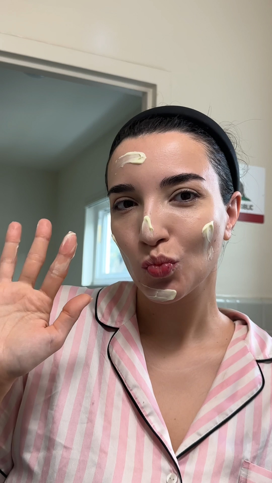 A woman with Eminence Organics Calm Skin Chamomile Cleanser on face