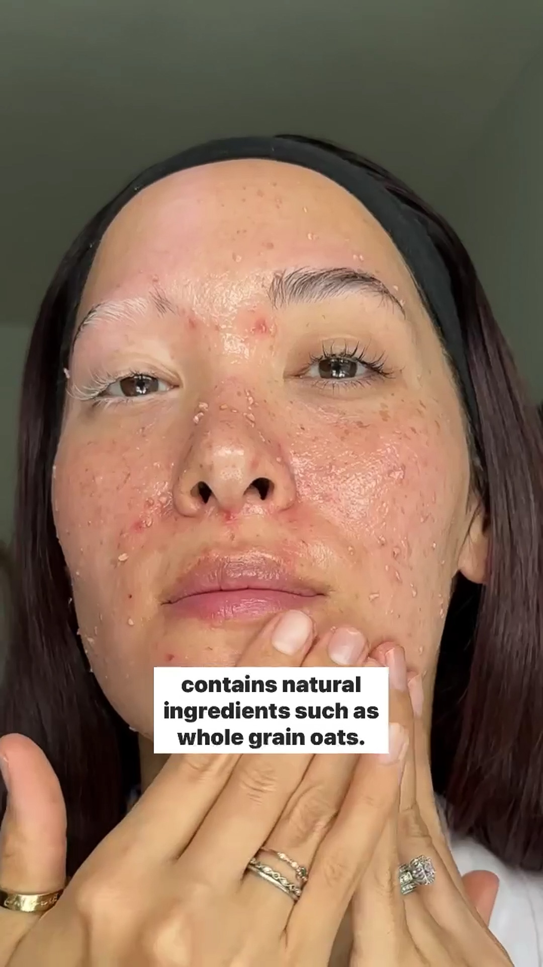 A woman applying the Eminence Organics Radish Seed Refining Peel on her face