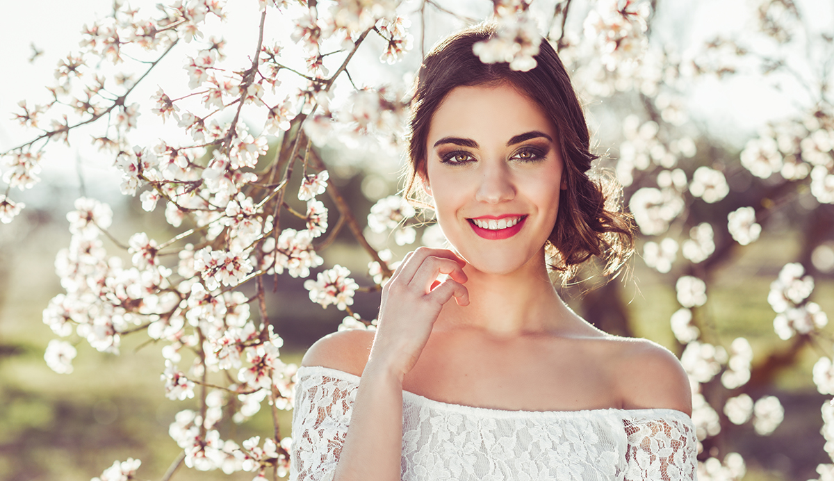 Bride under blossom tree