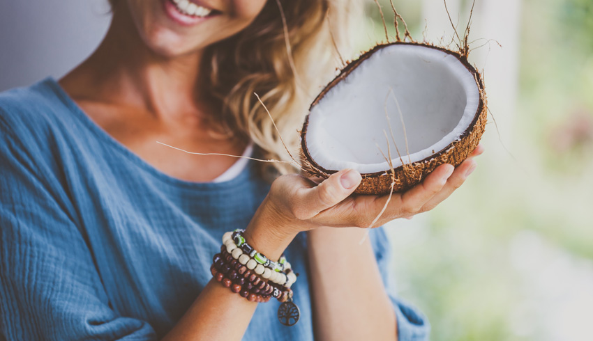 a woman with a coconut