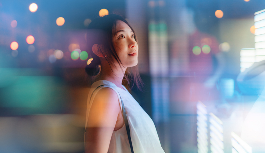 An Asian woman looking around