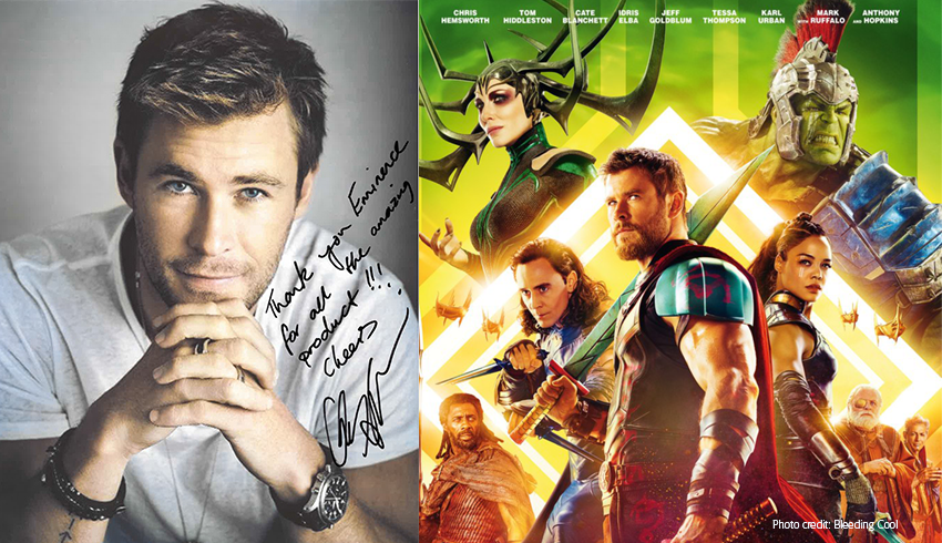 An autographed photo of Celebrity Chris Hemsworth displayed next to a  movie poster for 