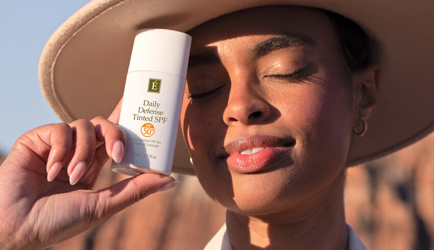 a woman holding SPF