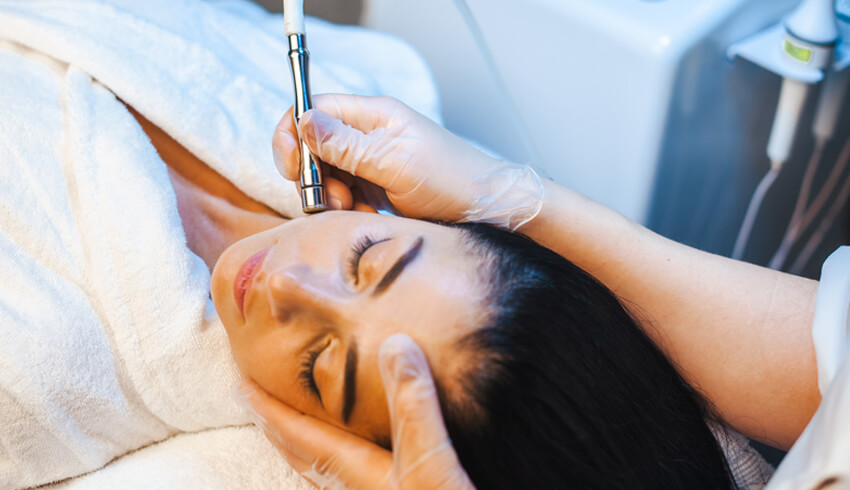 A woman undergoing a microdermabrasion.