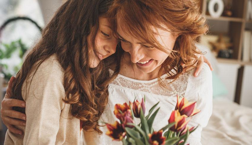 Mother and daughter with flowers