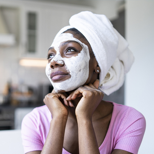 Black Woman Doing A Facial