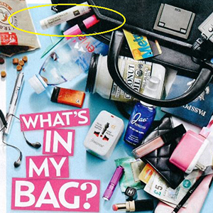 US Weekly feature showing Eminence Organics Hibiscus Ultra Lift Eye Cream in Archie Panjabi's bag