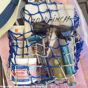 Cameron Diaz's beach bag containing Eminence Organics Facial Recovery Oil