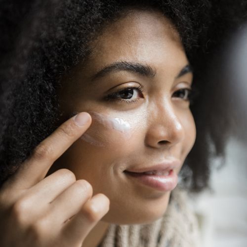woman applying eye cream