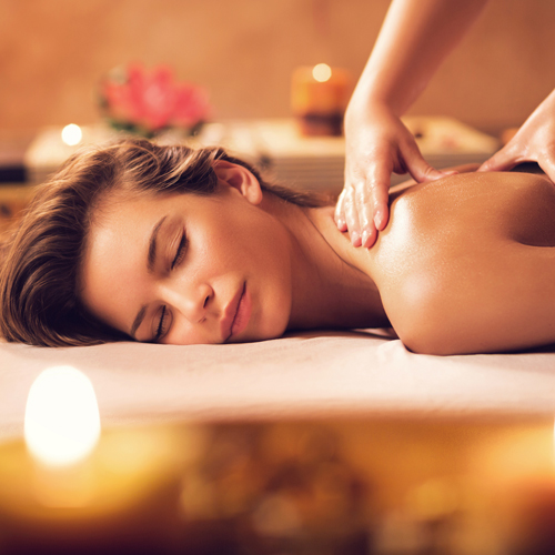 woman getting a massage at a spa
