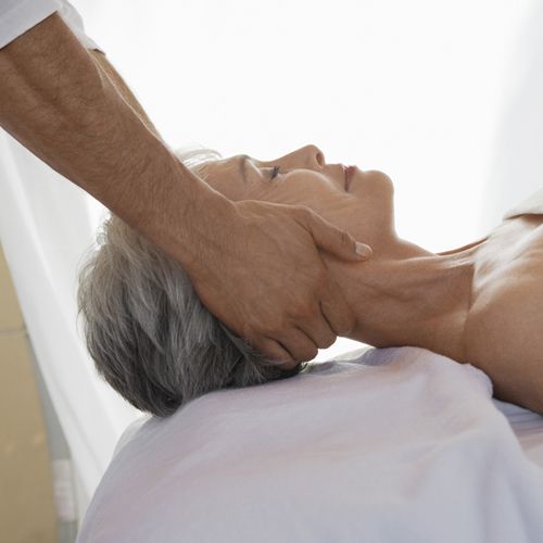 mature woman receiving neck massage