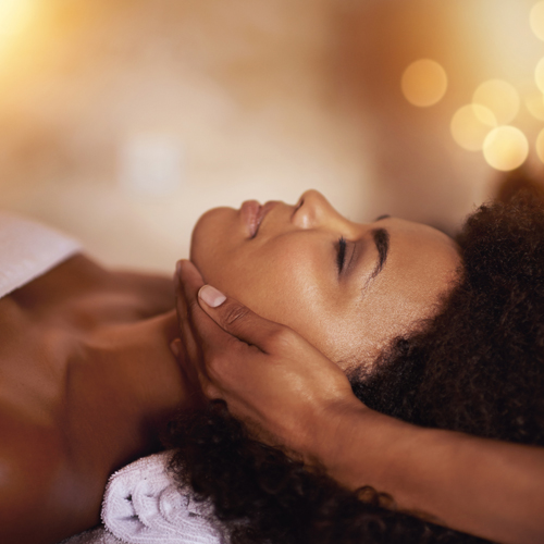 black woman getting a facial massage